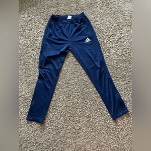 Boys Adidas pants with white stripes and zippers near the ankles!